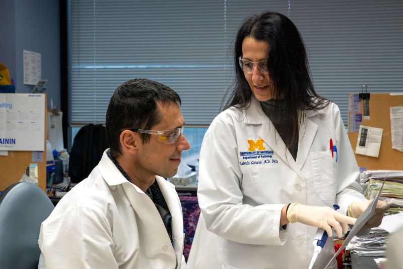 Dr. Roberta Caruso consults with Research Specialist Peter Kuffa